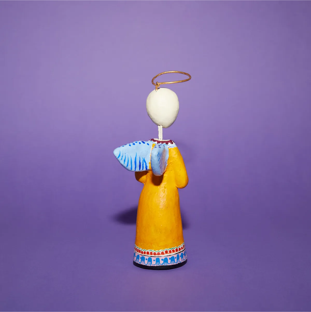 Ángel Saúl amarillo trasera