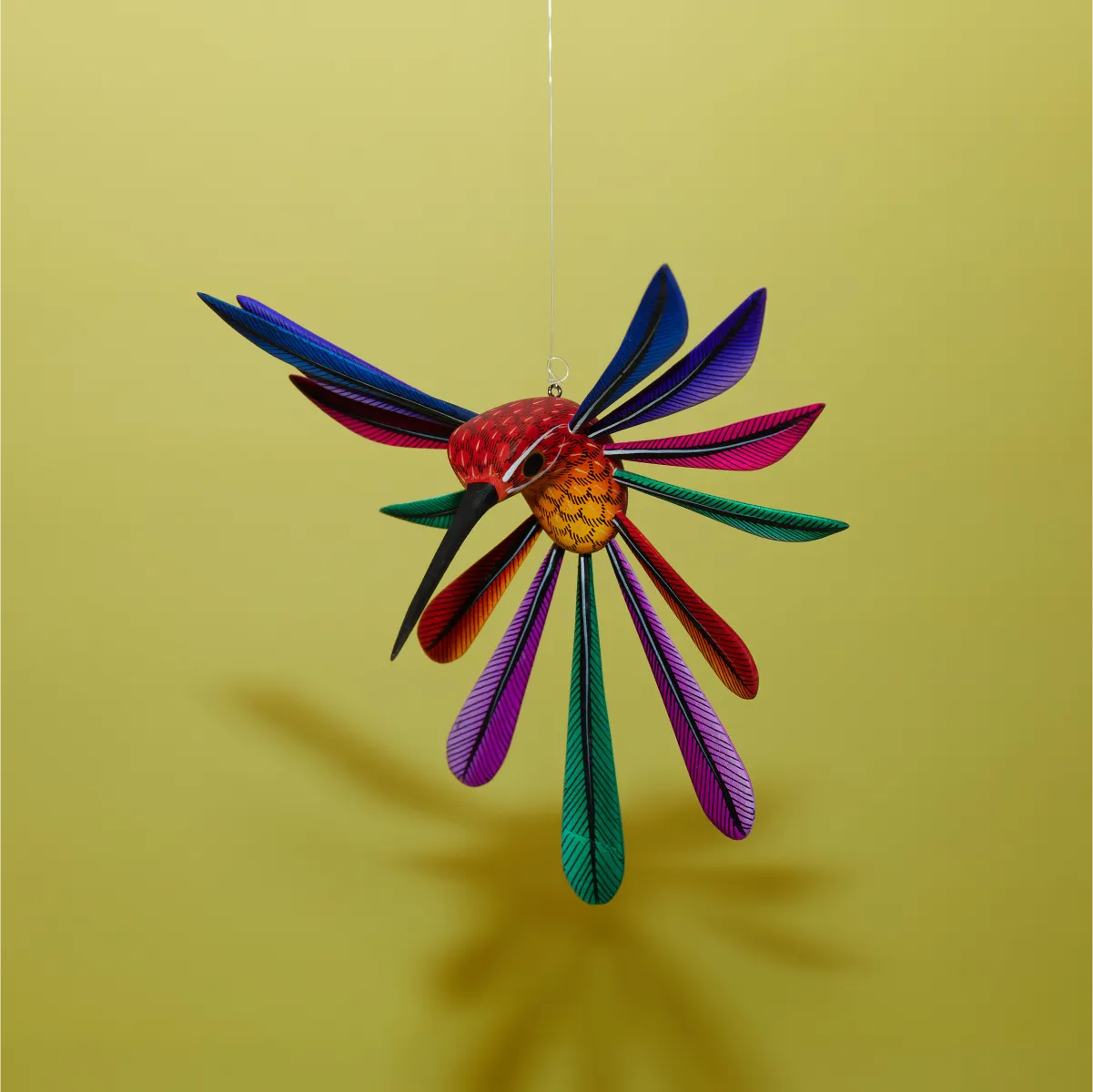 Colibrí naranja izquierda