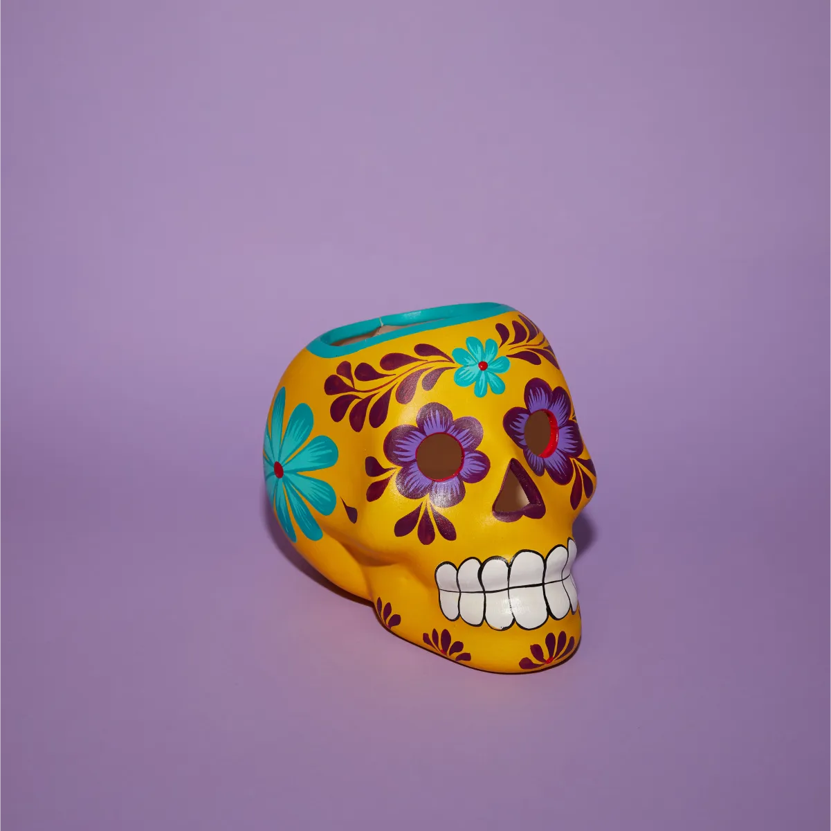 Cráneo candelero amarillo morado delantera